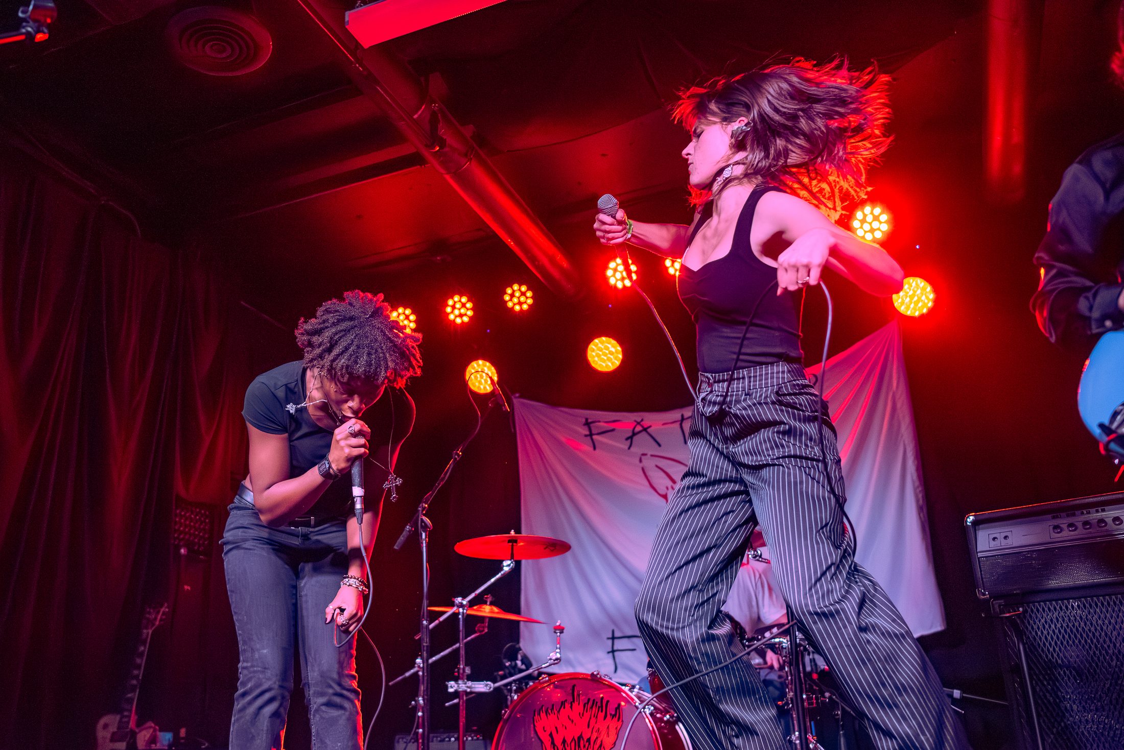 Chris and Toni performing on stage during their opening song of their performance.