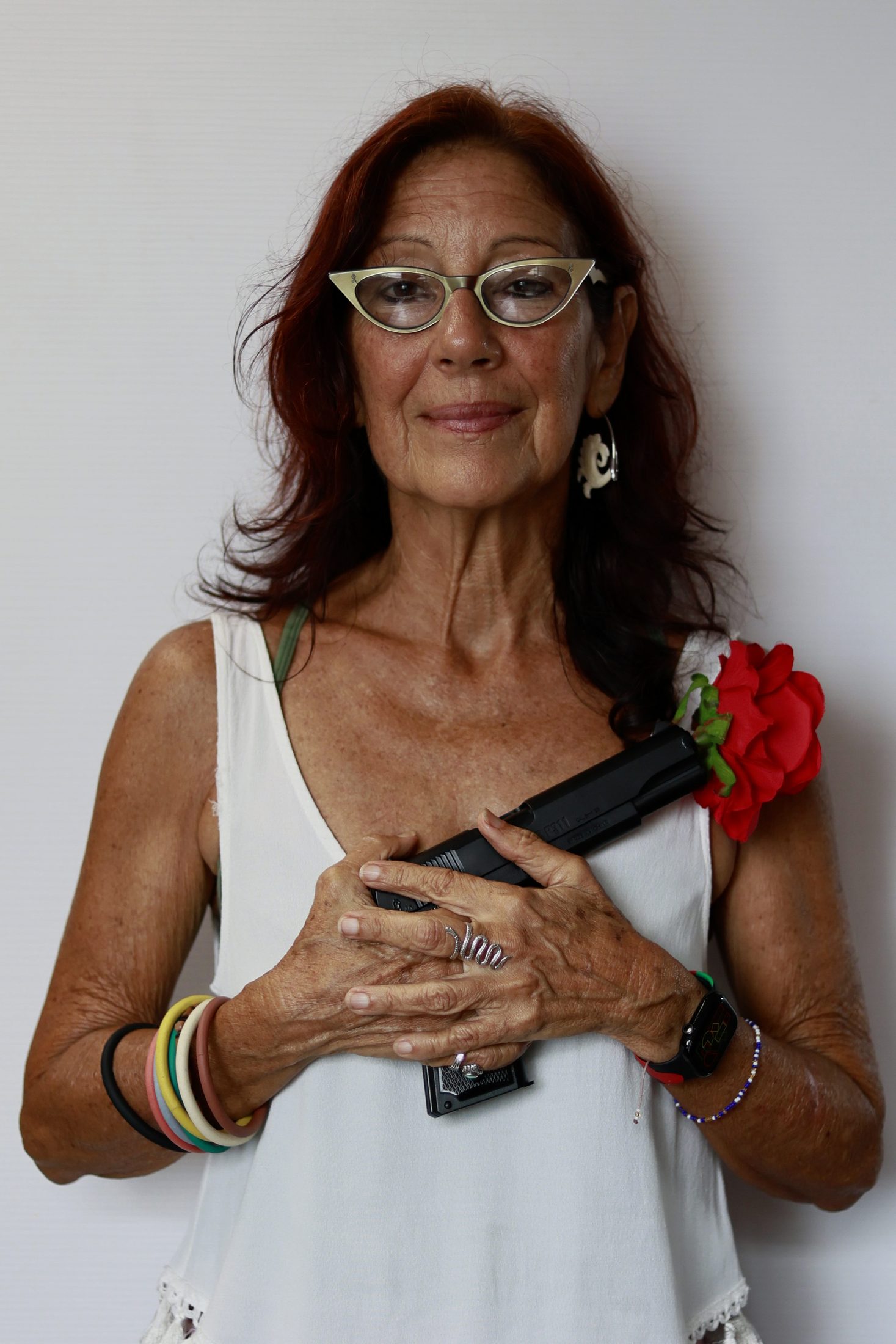 San Juan (PUERTO RICO), 06/25/2026. Gradissa Fernandez poses with Las Lolitas' symbol — a gun with flowers bursting from the barrel. Las Lolitas are a feminist, pro-independence group that honors the nationalist Lolita Lebrón. The Parlor Magazine/Thais Llorca