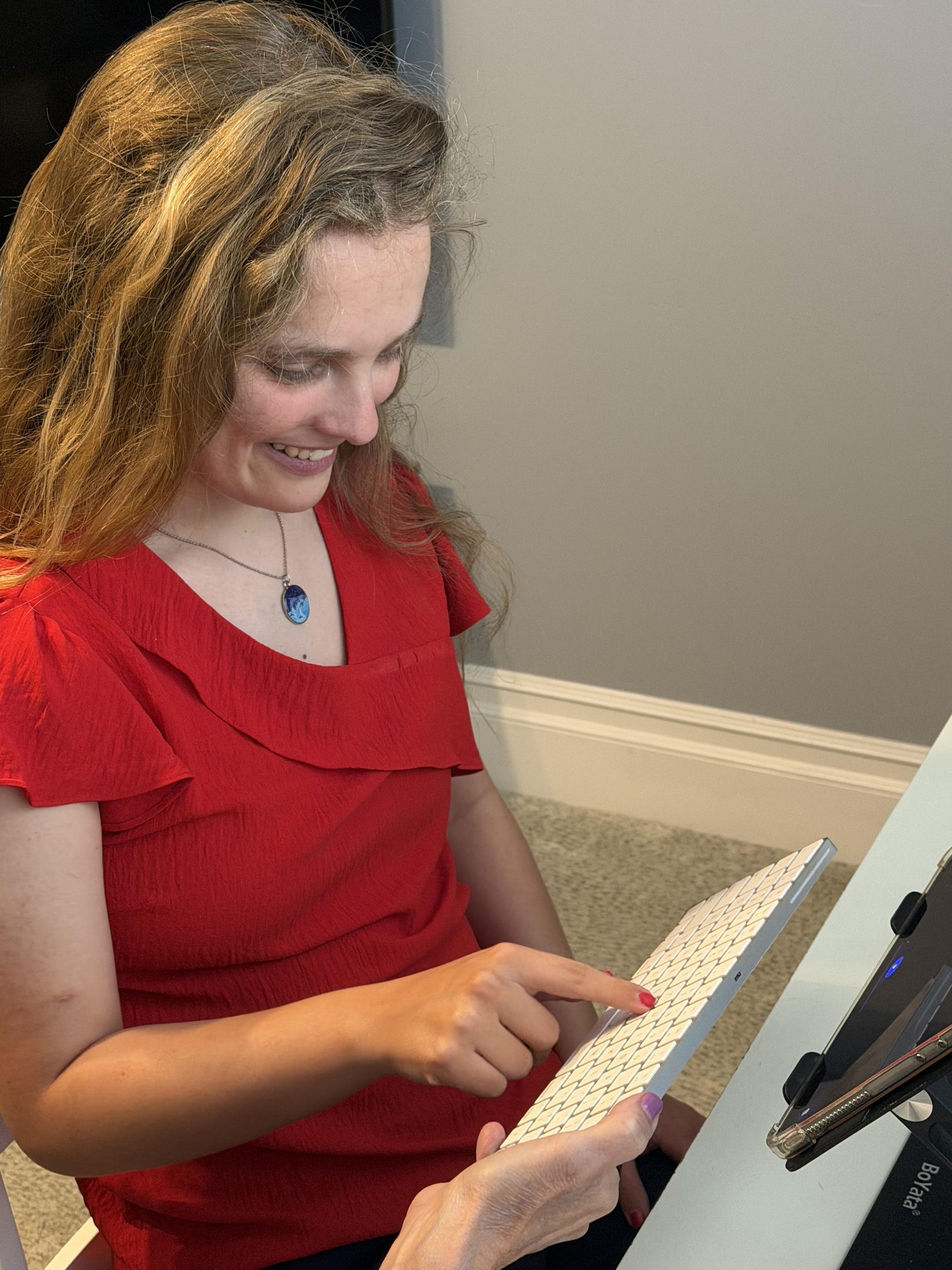 Lora spelling on a keyboard. Used with permission.