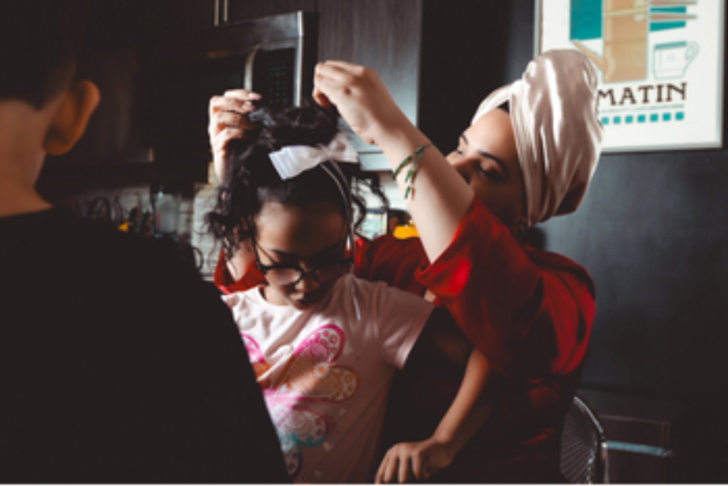  &nbsp; Anabelle fixes her daughter’s hair. Bernie Sinclaire describes the Mommune as a woman-centered and child-centered alternative family structure. LaniLee@lanileephotography. Used with permission.