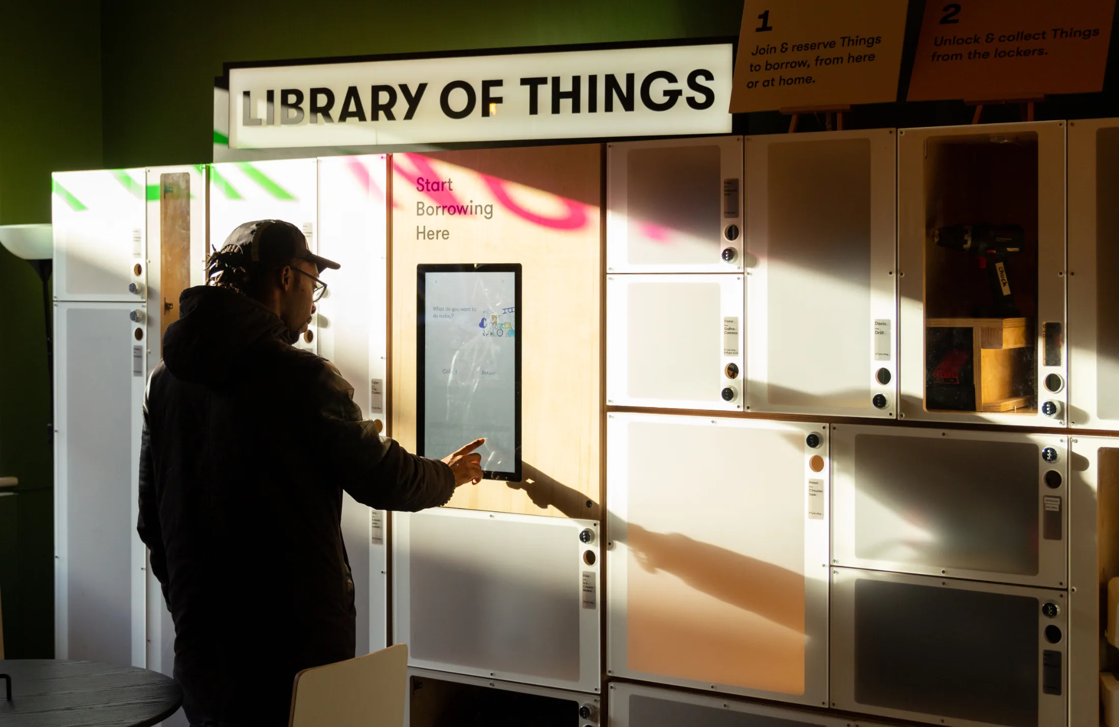 A borrower using the check-out kiosk at one of the locations. The library of Things has over 20 self-service locations across the UK | Credit: Eddie Hamilton. Used with Permission.